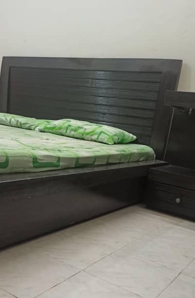 Double bed with side tables and dressing