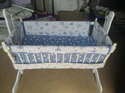 Baby swinging cot with bedding