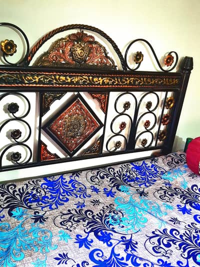 Double bed with side tables and two chairs