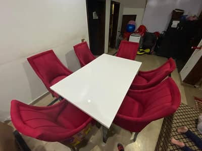 Dining table with 6 sofa chairs.