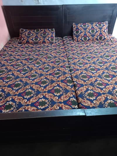 2 single beds with mattresses