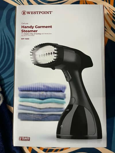 handheld garment steamer - used only once_ like new_ with 2 attachme