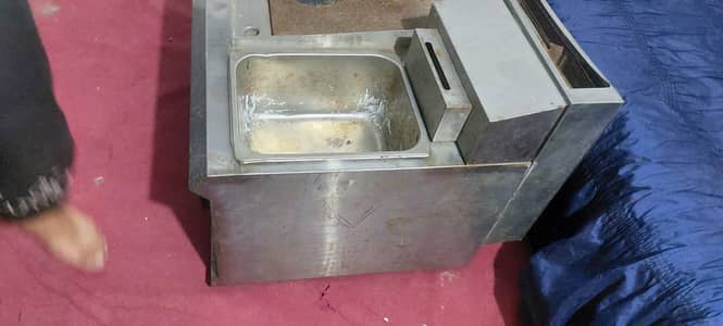 Stainless steel commercial kitchen sink.  food prep counter