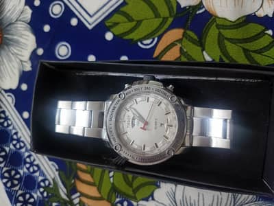 Tissot Watch with date and day
