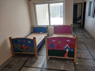 Wooden kids  2 single bed for sale