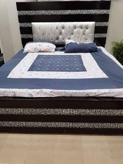 wooden bed with side tables