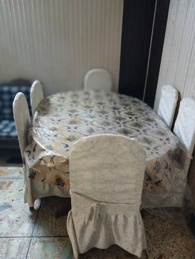 Dining table for sale with covers and sheet