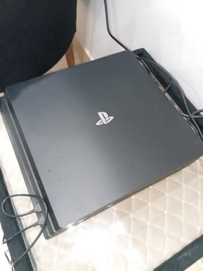 Playstation 4 pro 1 tb with 1 extra controller and games bundle