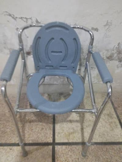 slightly used commode chair for patient