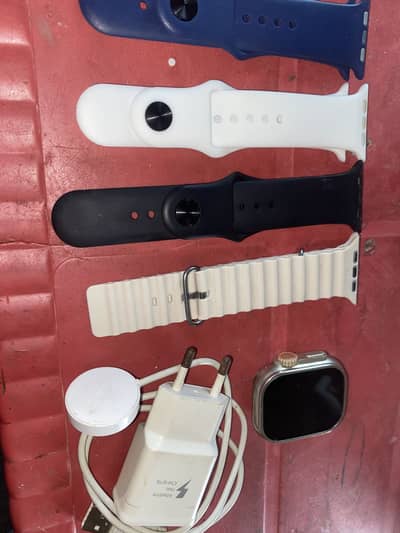 Smart watch with 4 bands & wireless charger + adapter.