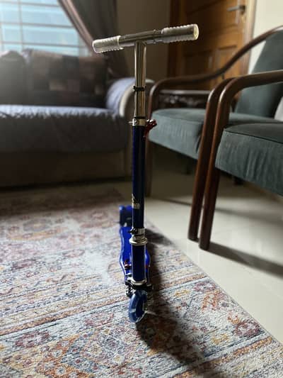 Brand new blue scooter for kids