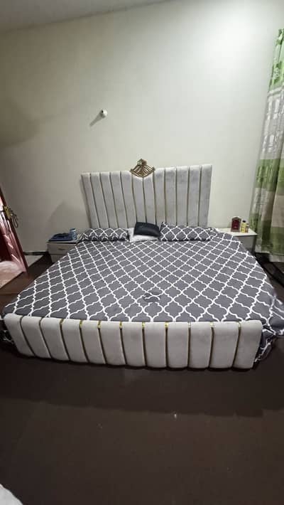 Double bed with two side tables without mattress