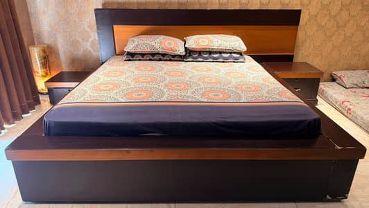 Wooden bed king size ,2 side tables and a king size dressing table