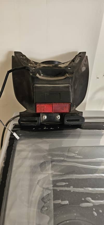 Hayabusa rear license plate light and reflector.