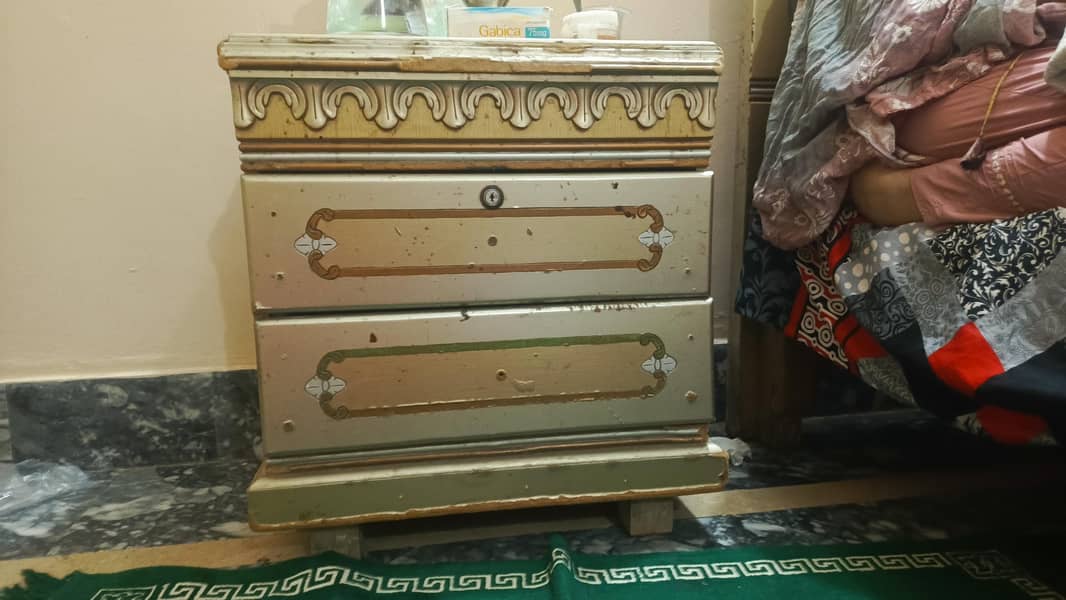 a bed with dressing table and side table 0