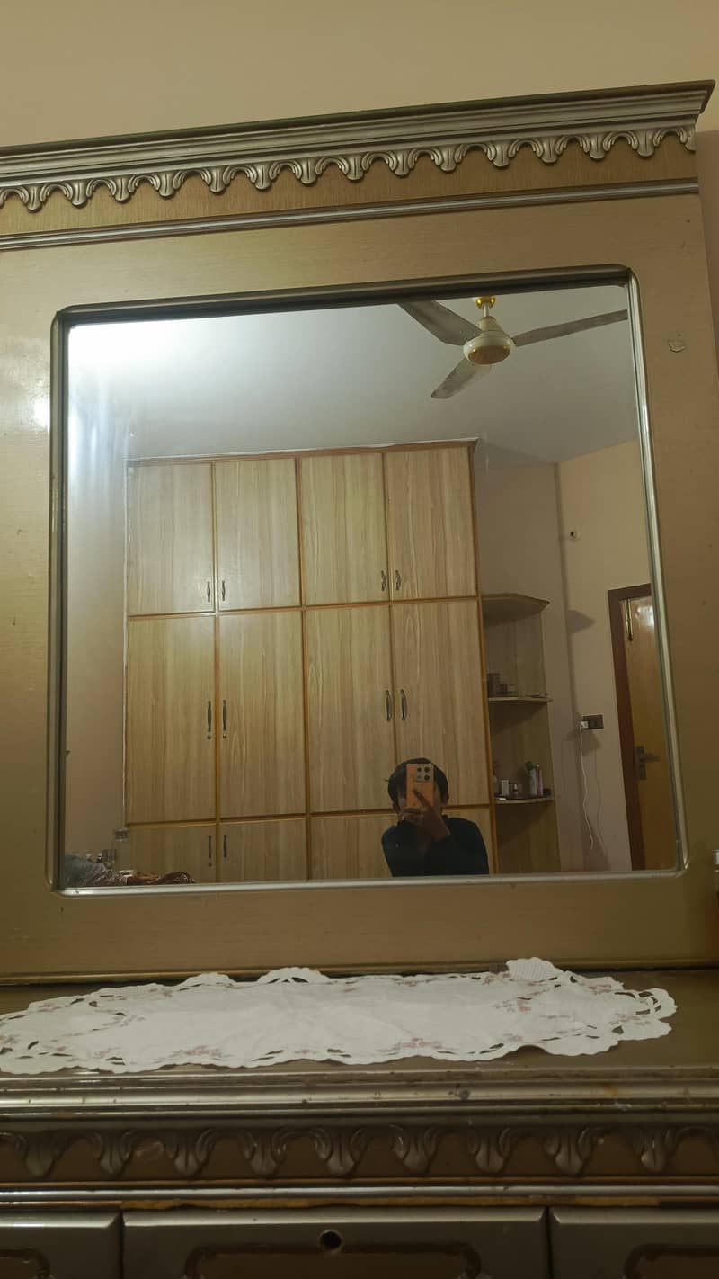 a bed with dressing table and side table 2