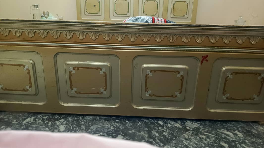 a bed with dressing table and side table 4