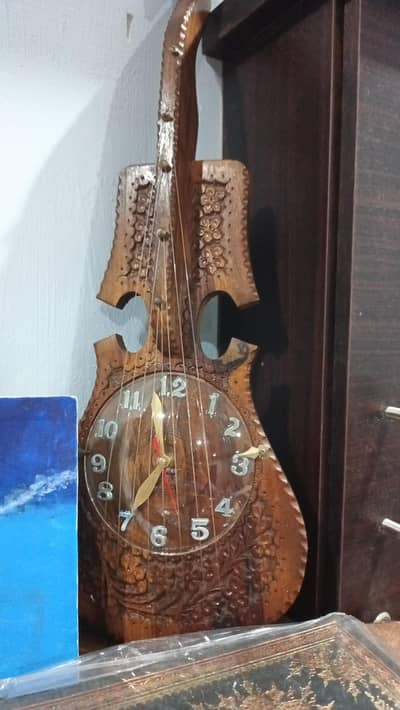 Wooden Hand Carved Guitar Wall Clock ₨3,990.00