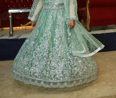 Wedding wear lengha choli in pastel green colour