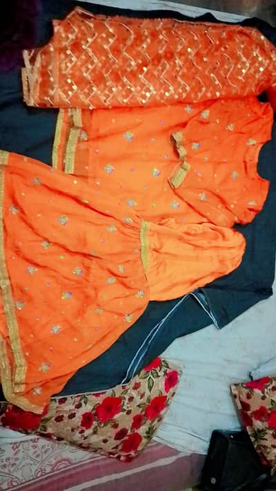 orangel colour sharara with shirt and dubatta