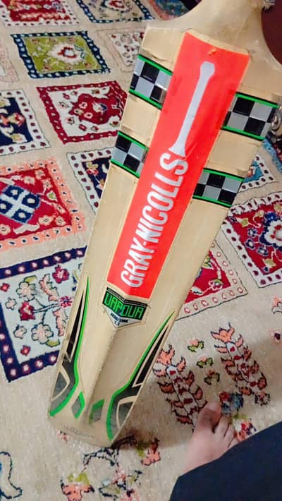 A grey nciolls hardball bat