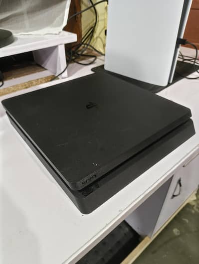 Playstation 4 Slim with Game Discs