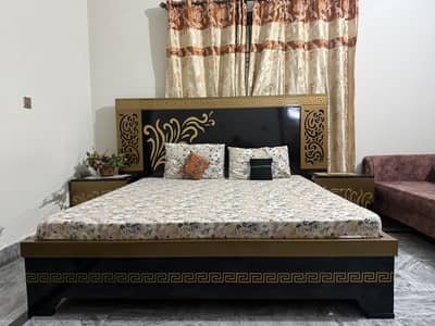 Wooden bed with side tables