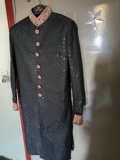 Royal Black Sherwani and matching khusa with Intricate Zari Work