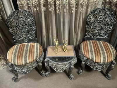 Wooden chairs with single coffee table
