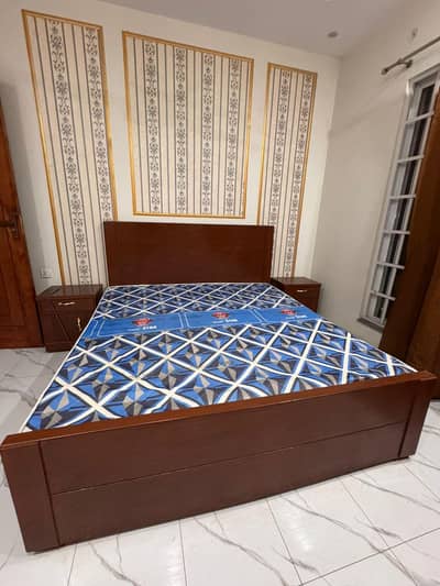 king bed with side tables and mattress