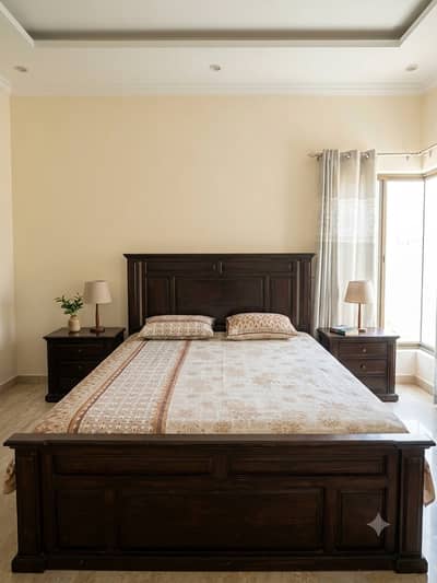 Bed with side tables and dressing table