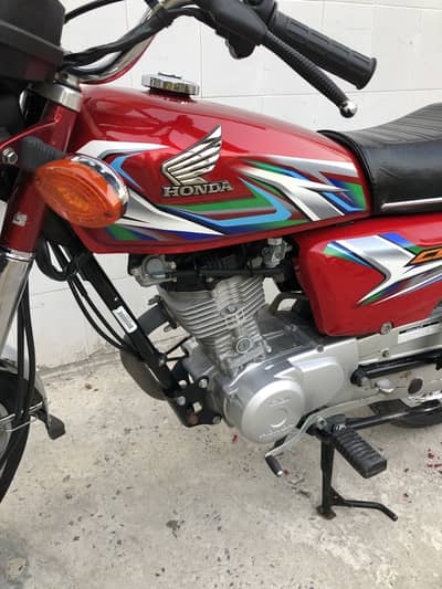Honda 125 2023 model red colour total genuine