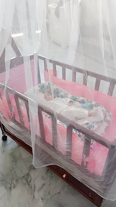 Baby cot with mosquito net