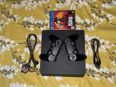 PS4 Slim (500gb) with 2 orginal controllers & 2 games!