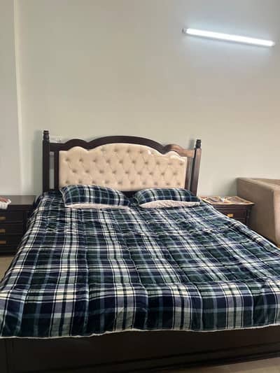 Bed with side tables and dressing table