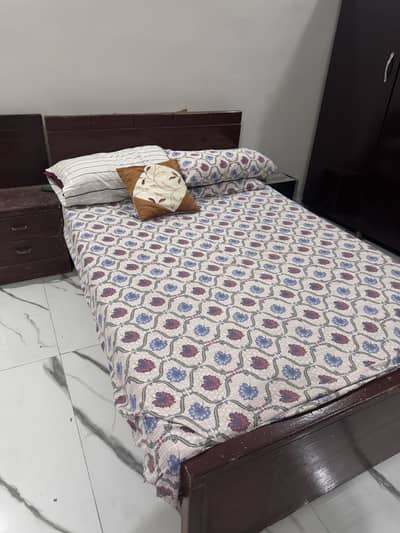 Single size bed with mattress and one side table