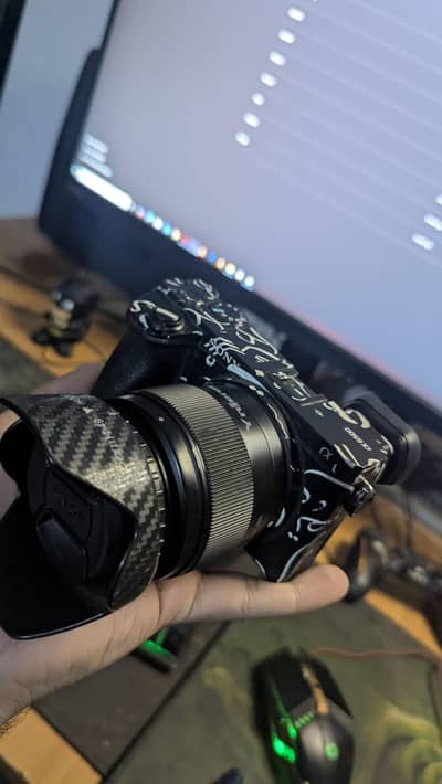 Sony A6500 with 50mm f1.8 lens.
