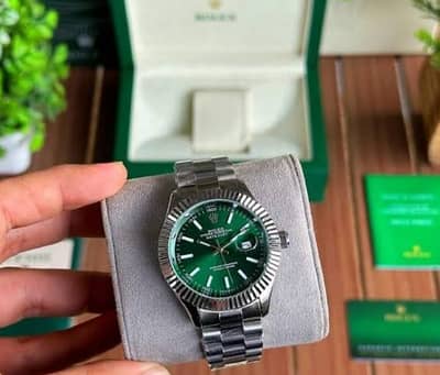 Rolex In green colour and red colour