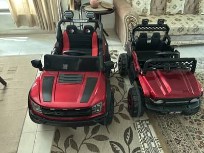 Two jeeps one big and one medium size