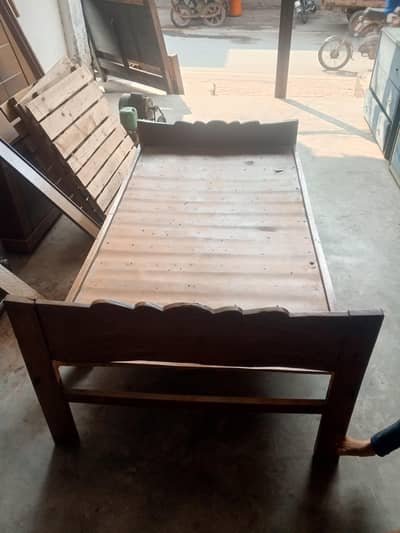 2 single wooden bed