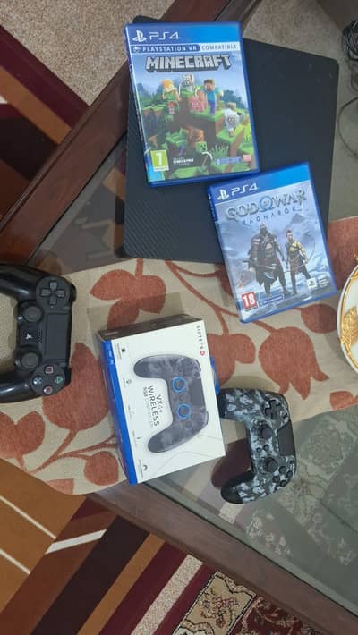 playstation 4 slim, 1tb, 2cds,original controller and   rgb controller