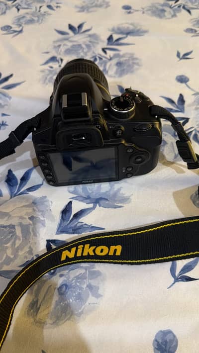 D3200 camera with 18-55mm lens.