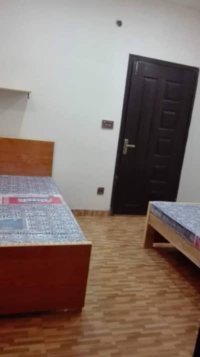 wooden and rode iron single bed with mattress