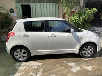 Suzuki Swift white 2013 model, full option, 2nd owner, minor touching