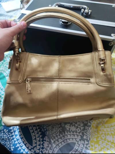 Golden hand bag