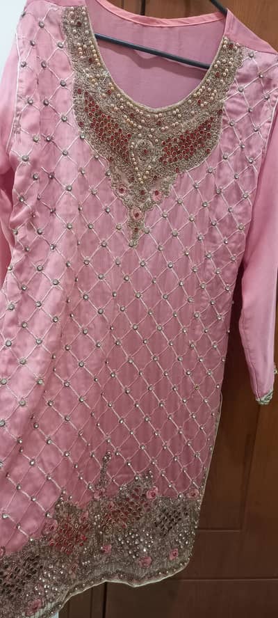 3 piece stiched dress with heavy embroidered work.