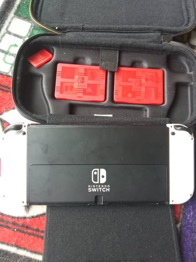 Nintendo OLED switch vedio game with 5 play cards