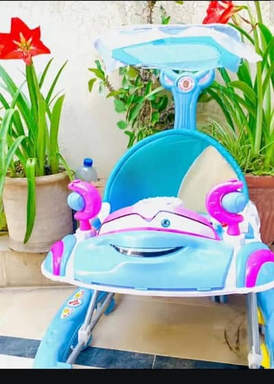 baby  walker. . toys king. .   just 2 months used. . in good condition