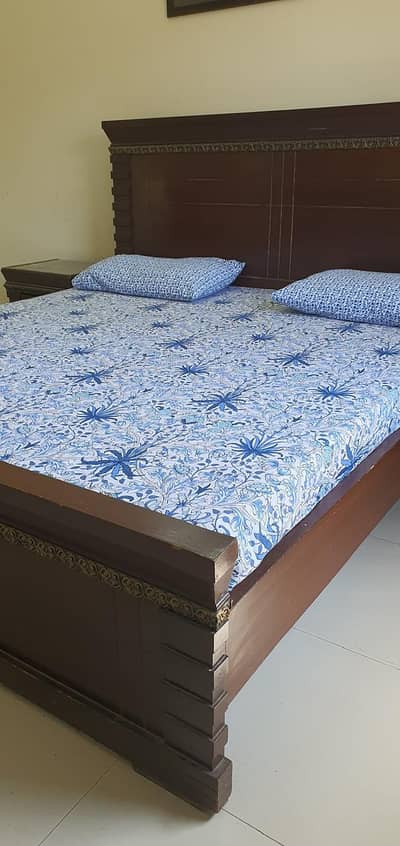 bed with side table with dressing