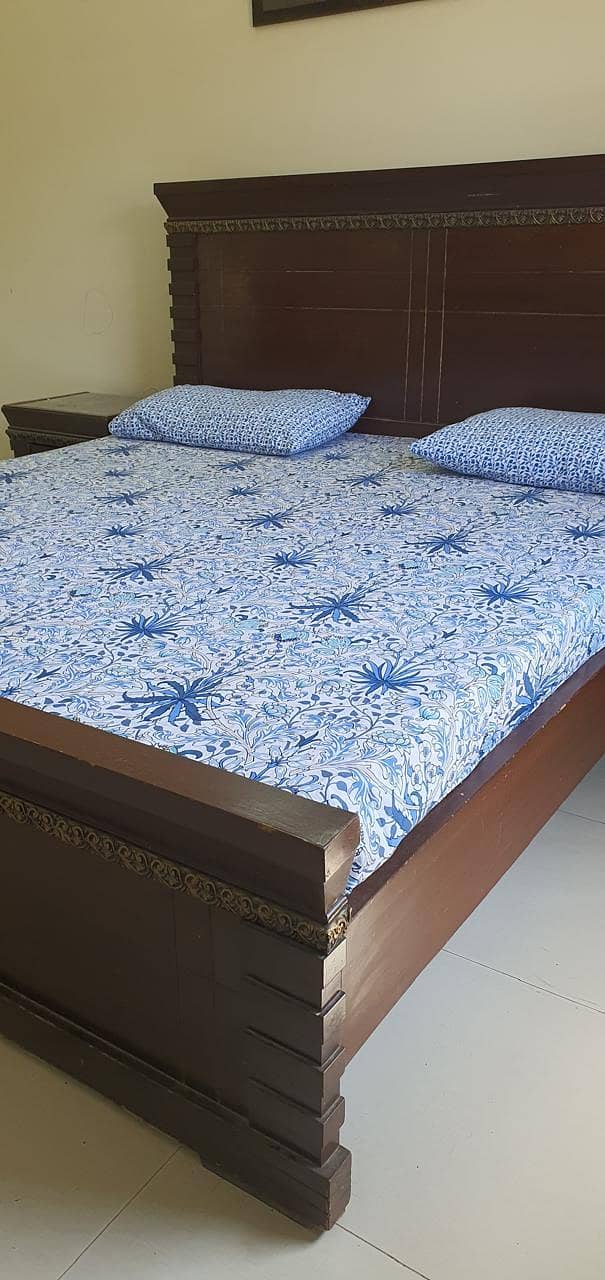 bed with side table with dressing 0